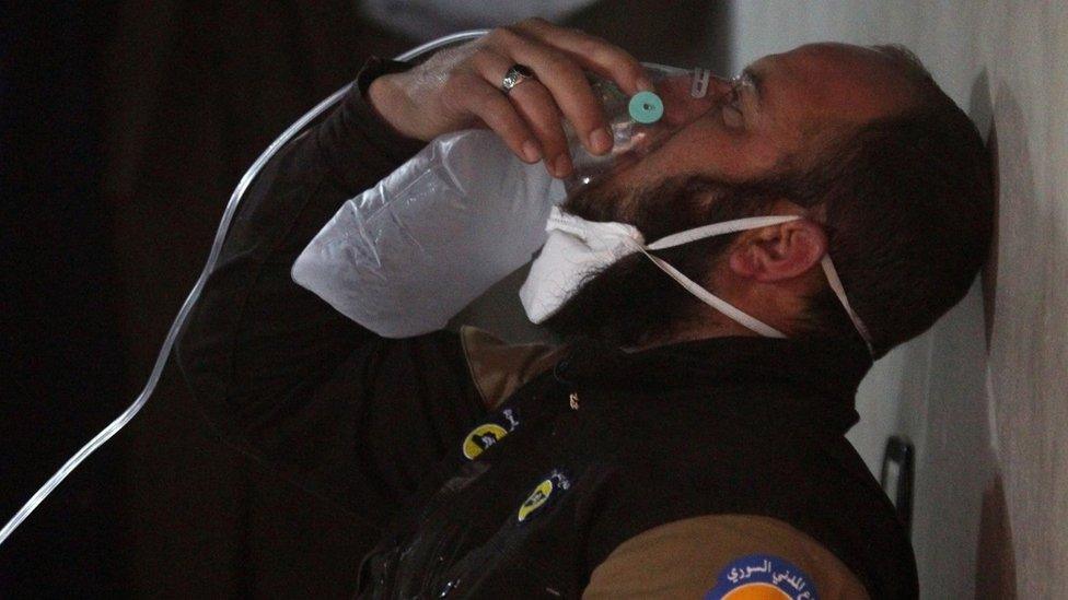 Civil defence volunteer, using an oxygen mask, after a suspected gas attack in the town of Khan Sheikhoun, Idlib, 4 Apr 2017