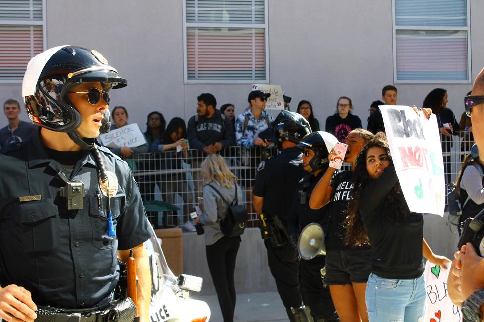 Police attend a protest on campus