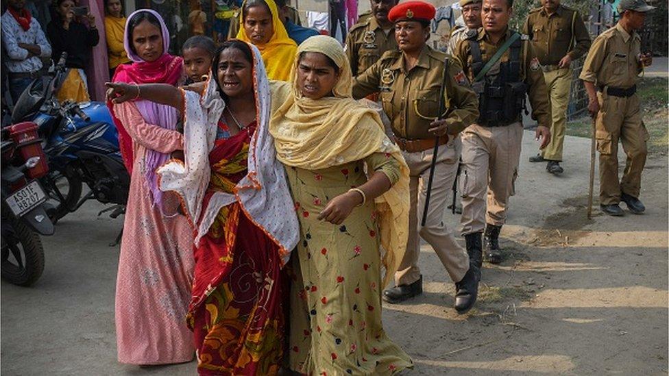 People react after police arrested their relatives allegedly involved in child marriages, during Assam government's state-wide crackdown on child marriages, near Mayong police station in Morigaon district of Assam on February 4, 2023.