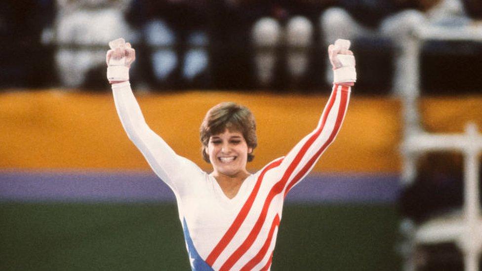 Mary Lou Retton of the USA celebrates following her uneven parallel bar performance during the Women's Gymnastics competition of the 1984 Summer Olympic Games held from July 30 to August 3, 1984 at Pauley Pavilion in Los Angeles, California.