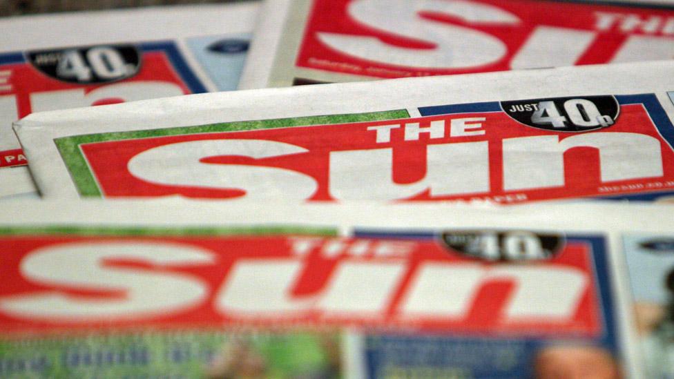 Copies of The Sun newspaper