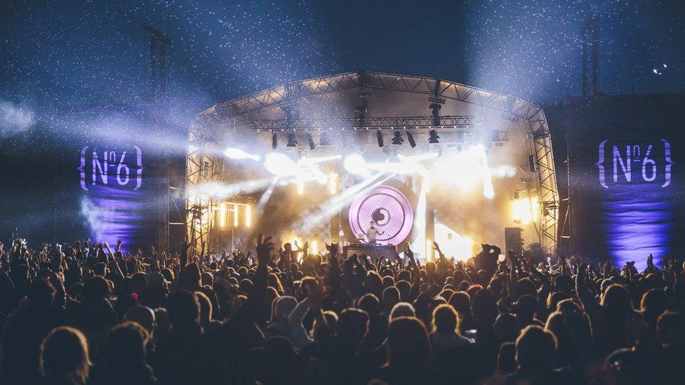 Mark Ronson gets the crowd on its feet during his set on the main stage on Friday.