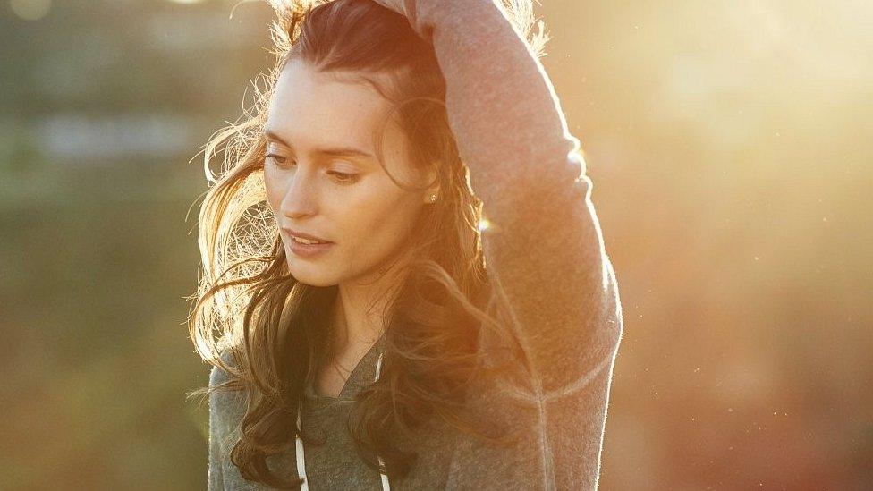 A girl photographed in the sunshine