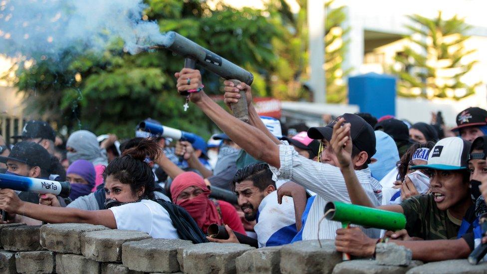 Demonstrators fire a homemade mortar during a protest against Nicaraguan President Daniel Ortega's government in Managua, May 30, 2018