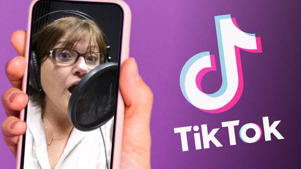 Bev Standing with a TikTok image