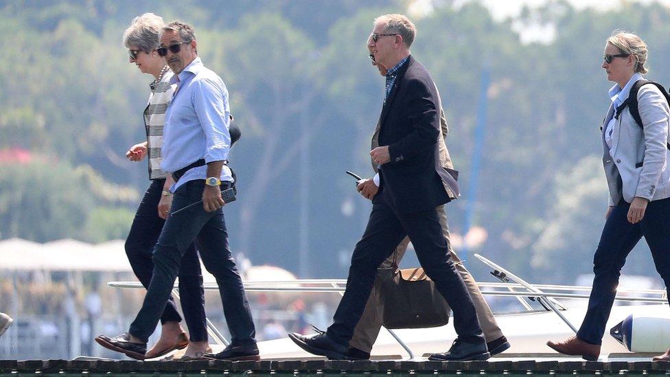 Theresa May and her husband Philip arriving in Italy