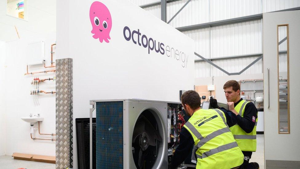 Engineers install a heat pump at the Octopus Energy training facility in Slough, England.