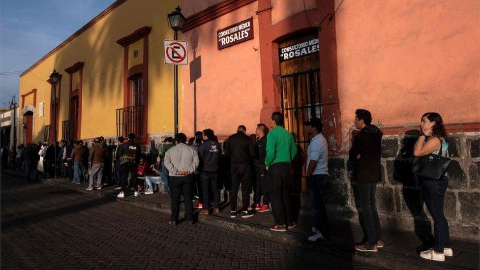 People queue to vote during the presidential election at a polling station in Xochimilco, Mexico City on July 1, 2018.