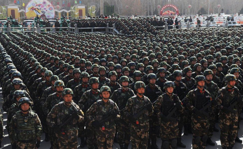 Paramilitary policemen stand in formation as they take part in an anti-terrorism oath-taking rally, in Kashgar, Xinjiang Uighur Autonomous Region, China, 27 February 2017.