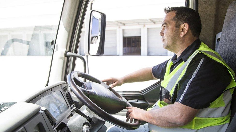 Lorry driver leaving a warehouse