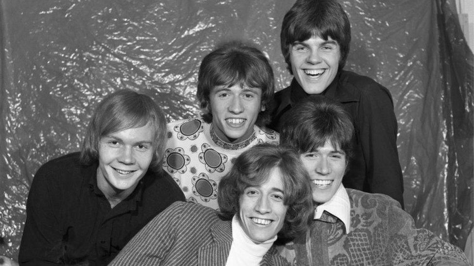 The Bee Gees backstage at Top of the Pops, sometime between 1967 and 1969. Back Row L- R: Colin Petersen; Maurice Gibb and Vince Melouney. Front Row L-R: Robin Gibb and Barry Gibb.