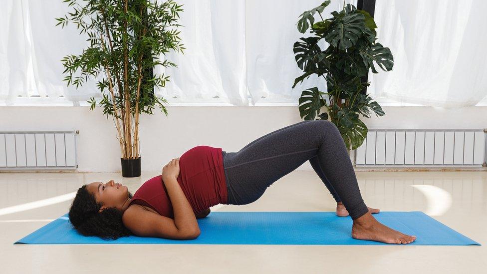 Pregnant woman doing yoga