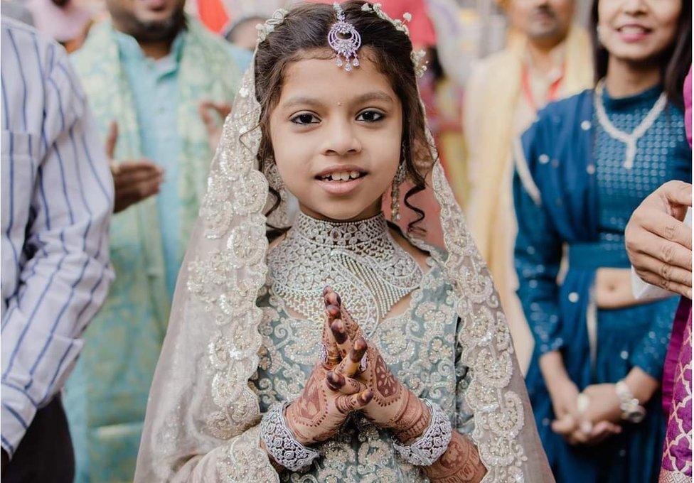 Devanshi was taken in a procession through the streets of Surat, bejewelled and dressed in expensive clothes