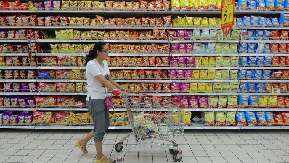 A woman shops at a supermarket in Fuyang, China.