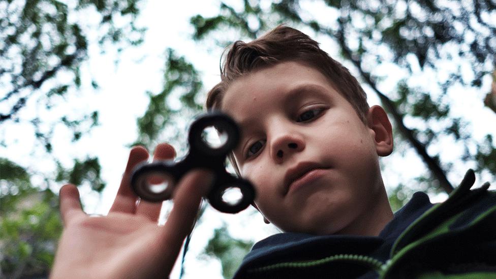 Boy with fidget spinner