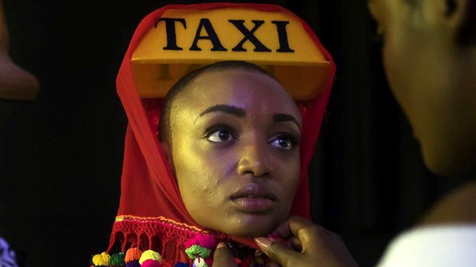 Models get ready backstage prior to walk down the runway at the Hub of Africa, Addis Fashion Week in Addis Ababa, on October 03, 2018