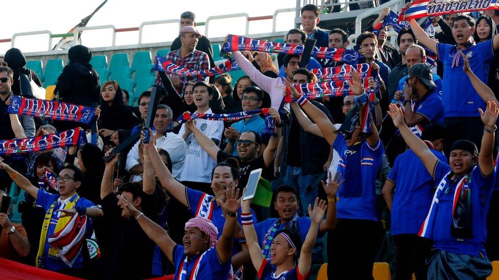 Thai fans cheer on their national team during the 2018 World Cup qualifying football match between Thailand and Iraq at the Shahid Dastgerdi Stadium in the Iranian capital, Tehran, on October 11, 2016.