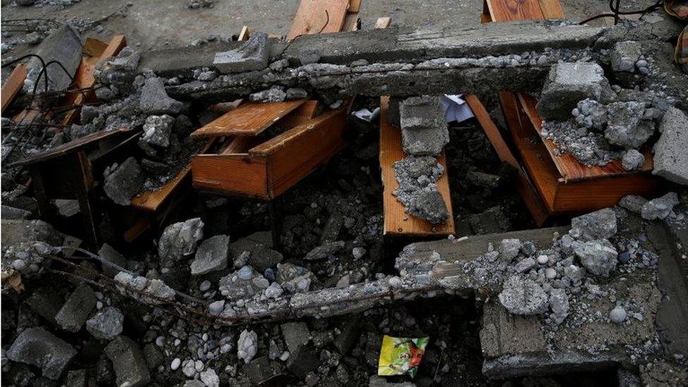 Destroyed desks are seen in a school after Hurricane Matthew passes Jeremie, Haiti, 5 October 2016.