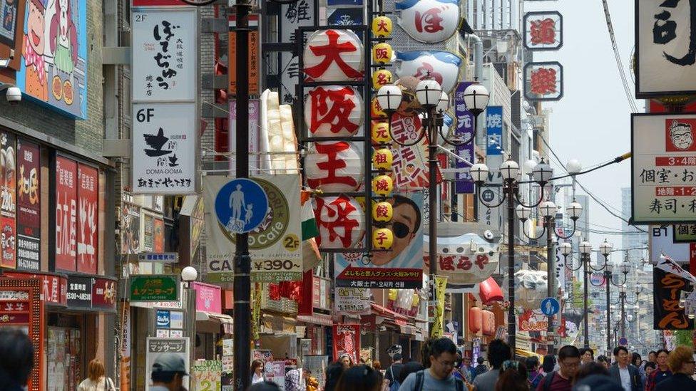 Pedestrians crowd in the main shopping street in the Dotonbori district of Osaka on March 28, 2015 in Osaka, Japan. (Photo by Frédéric Soltan/Corbis via Getty Images)