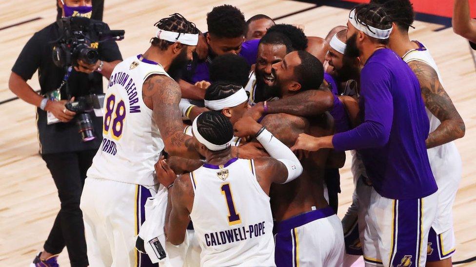 The LA Lakers celebrate their win