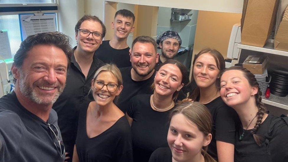 Hugh Jackman with restaurant staff