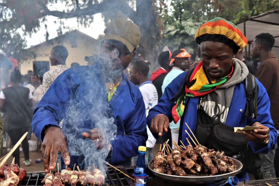 People grilling meat