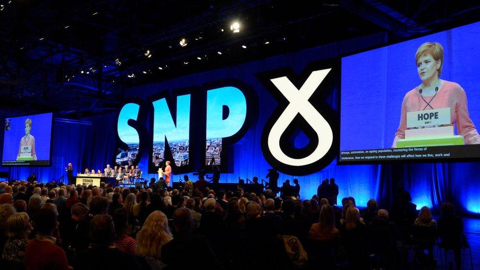 SNP conference stage wide shot from April