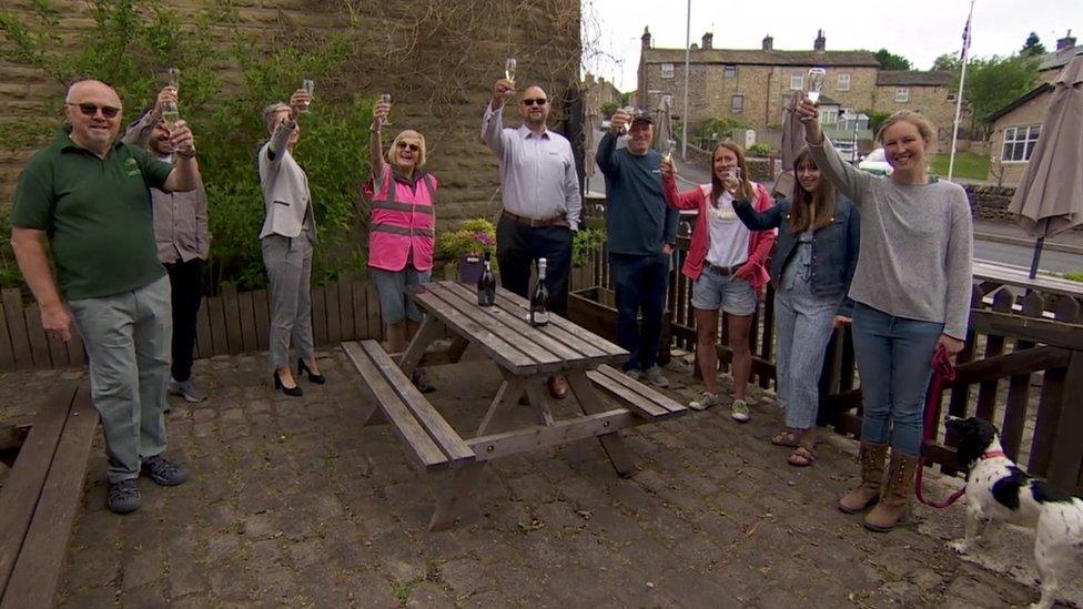 Locals toast the success of a campaign to save The Trawden Arms