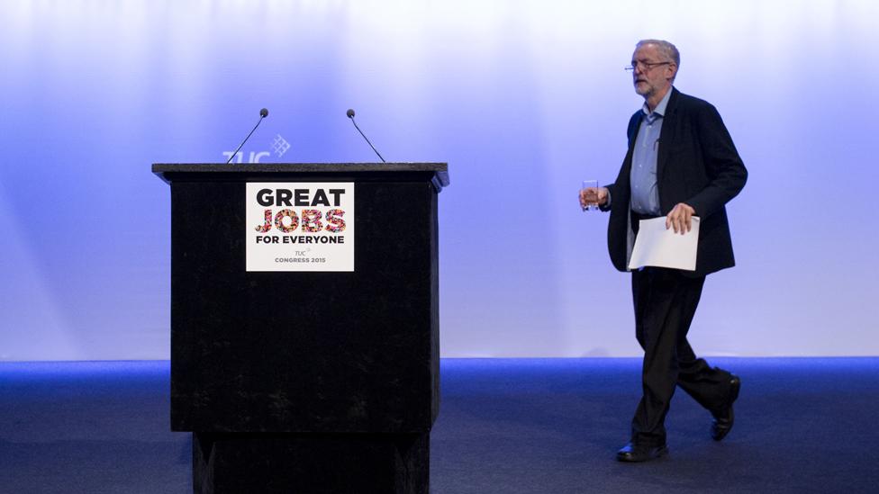 Jeremy walks to the podium