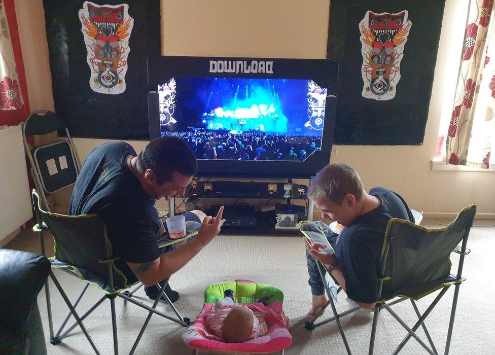 Fans at home watching Download