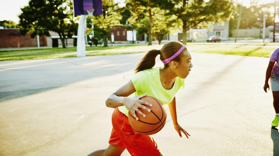 girl-playing-basketball