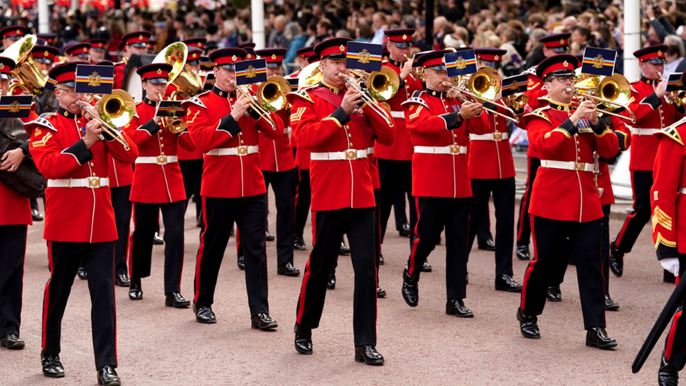 The funeral procession marched down Horse Guards Road