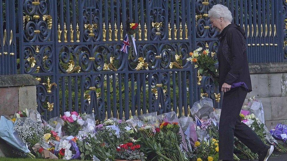 Lady Mary Peters laying flowers at Hillsborough Castle following the death of the Queen