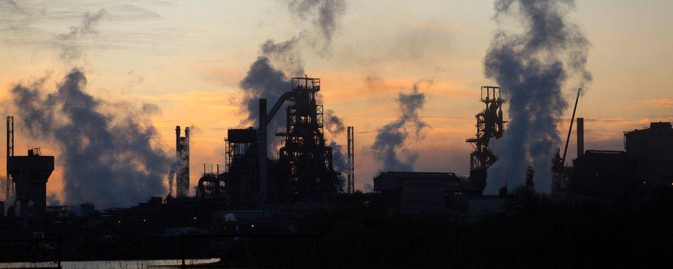 The sun rises behind the Tata steelworks in Port Talbot