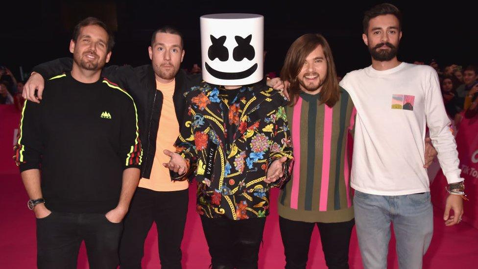 Members of Bastille with Marshmello