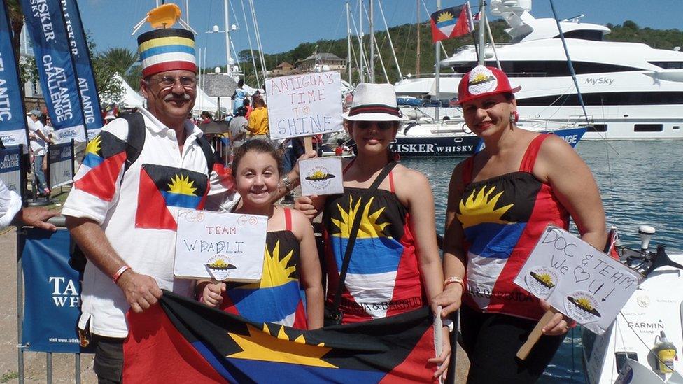 Islanders donned national flags to welcome the team home