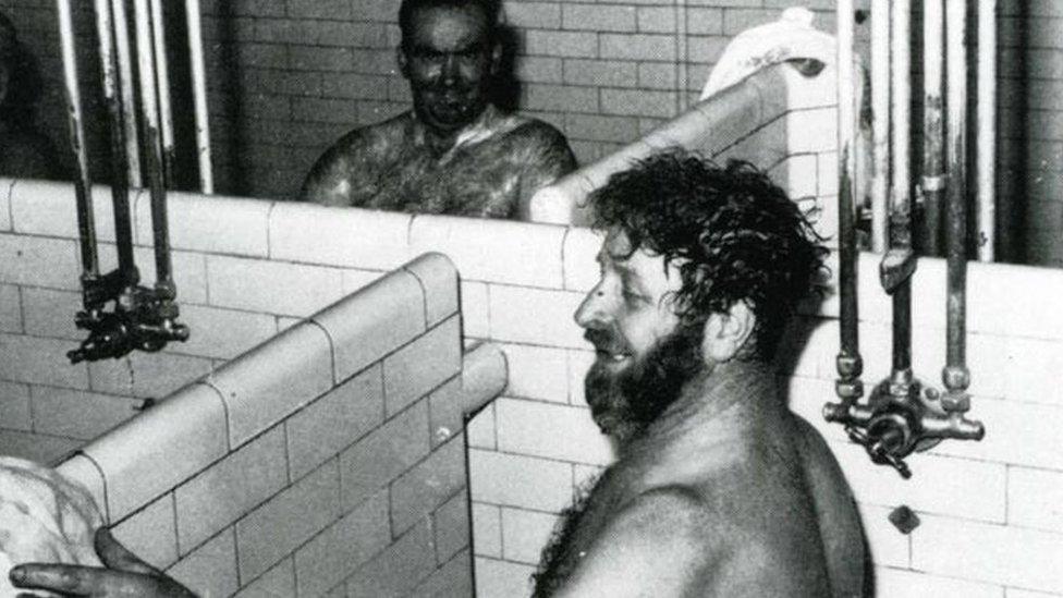 Two miners use the Big Pit Blaenavon baths, now the Big Pit National Coal Museum