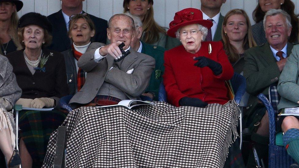 Queen Elizabeth and Prince Philip watch competitors at the Braemar Gathering in September 2015