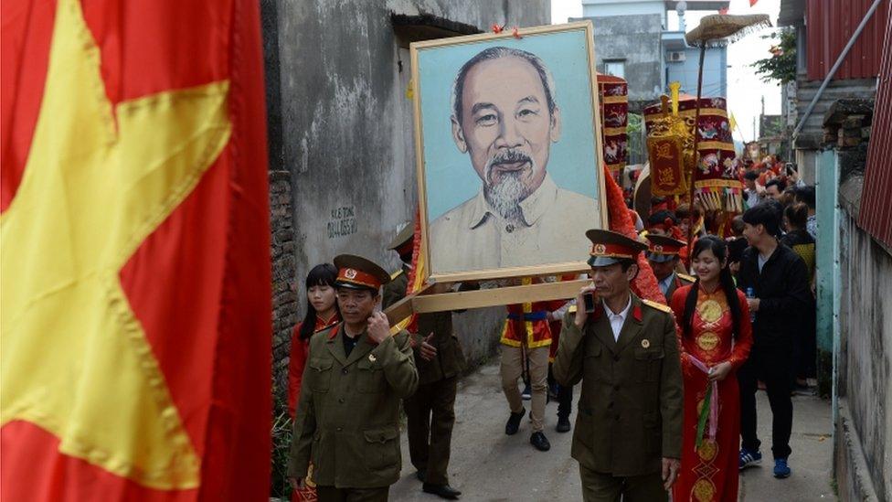 Veterans carry a portrait of Ho Chi Minh in a village procession in northern Vietnam (Feb 2015)