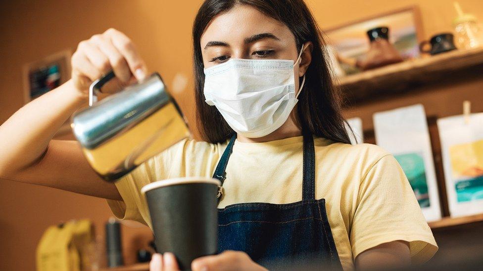 Young woman working in a cafe