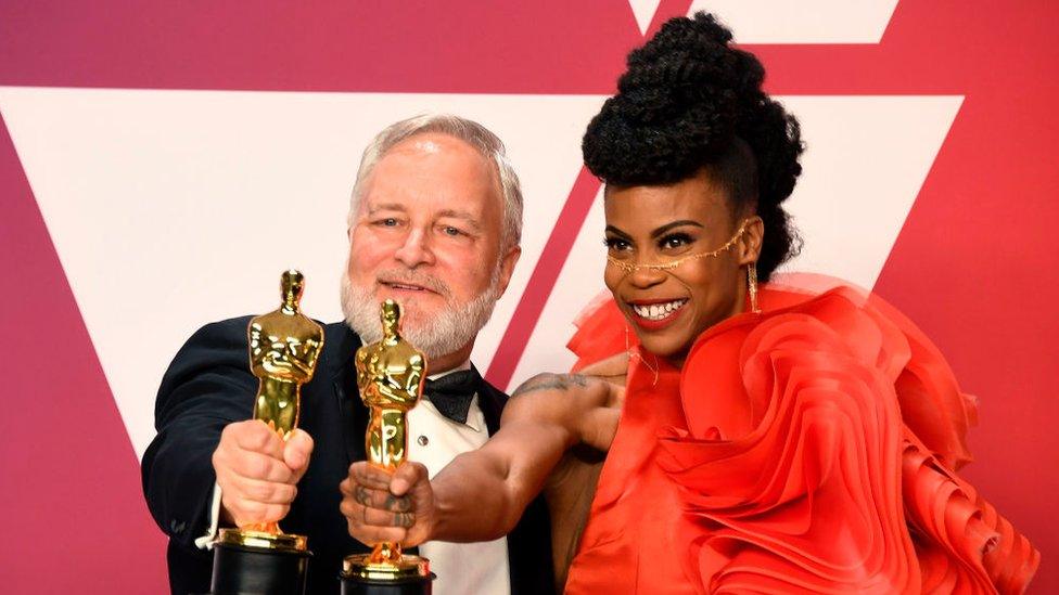 Jay Hart and Hannah Beachler, winners of Best Production Design for 'Black Panther,' pose in the press room during the 91st Annual Academy Awards at Hollywood