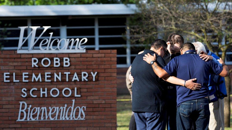 People react after a mass shooting at Robb Elementary School in Uvalde