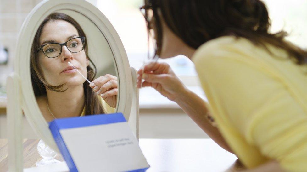 Woman doing a Lateral Flow Test