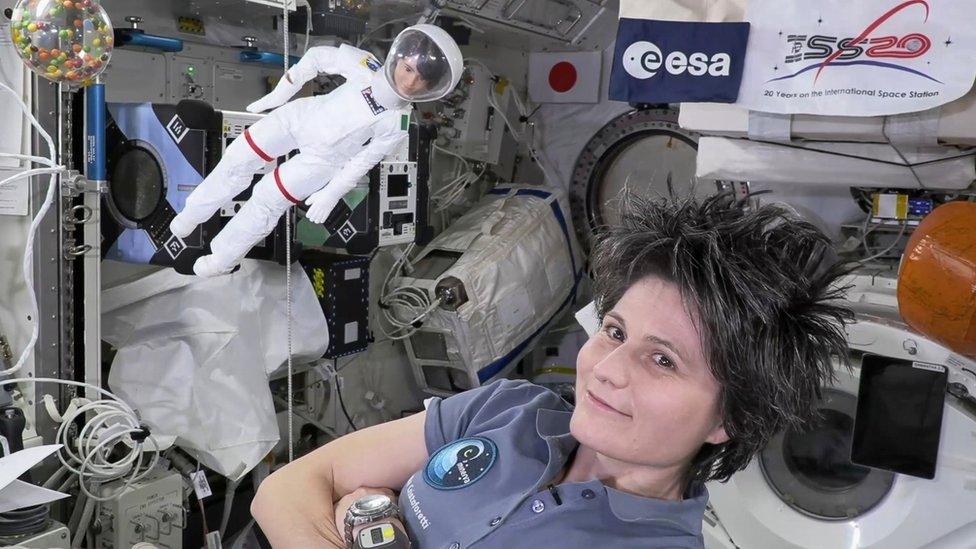 Samantha Cristoforetti and her barbie doll in the ISS