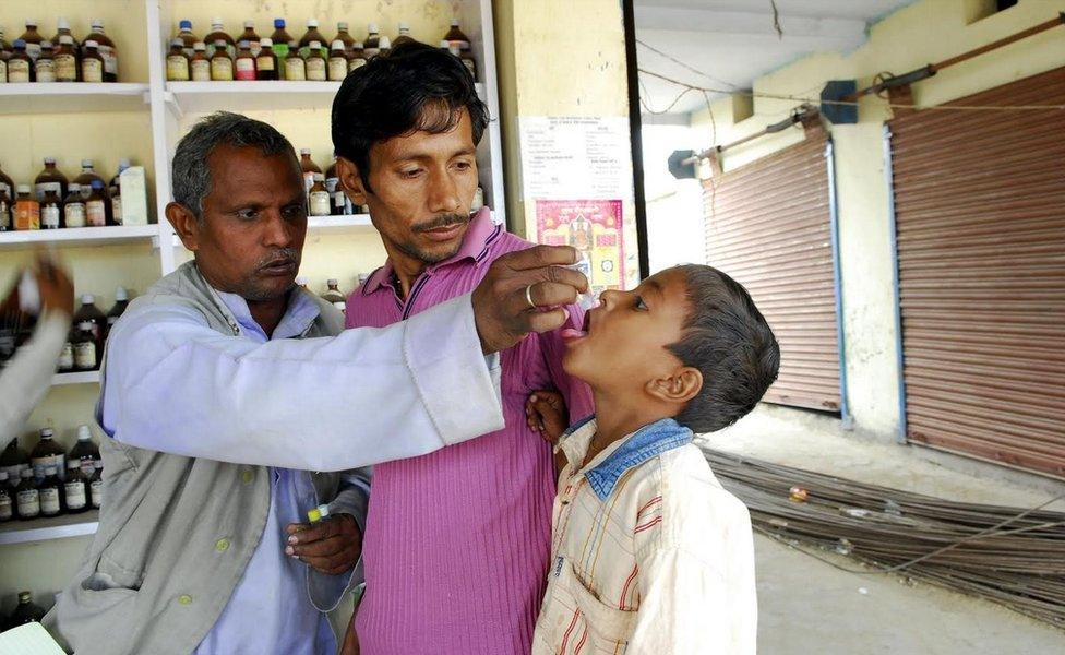 A quack treating patients in his clinic