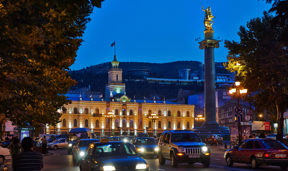 Traffic in front of Tbilisi city hall at night