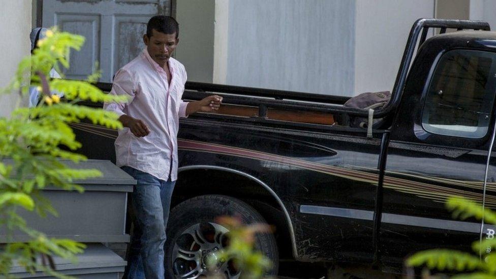 Nicaraguan Reynaldo Peralta Rodriguez leaves the morgue with the coffin of his wife, Vilma Trujillo, Nicaragua, 28 February 2017