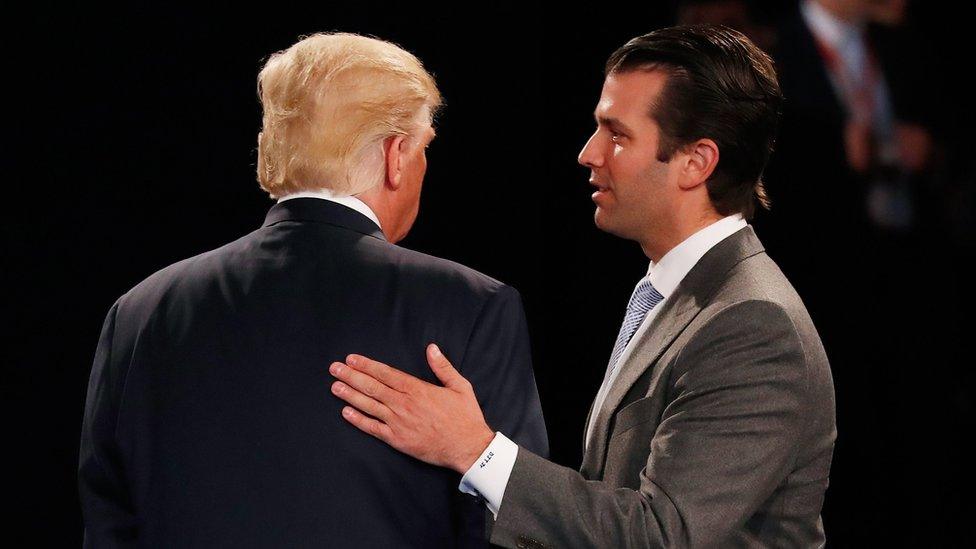 Donald Trump Jr greets his father Republican presidential nominee Donald Trump during a debate in October 2016