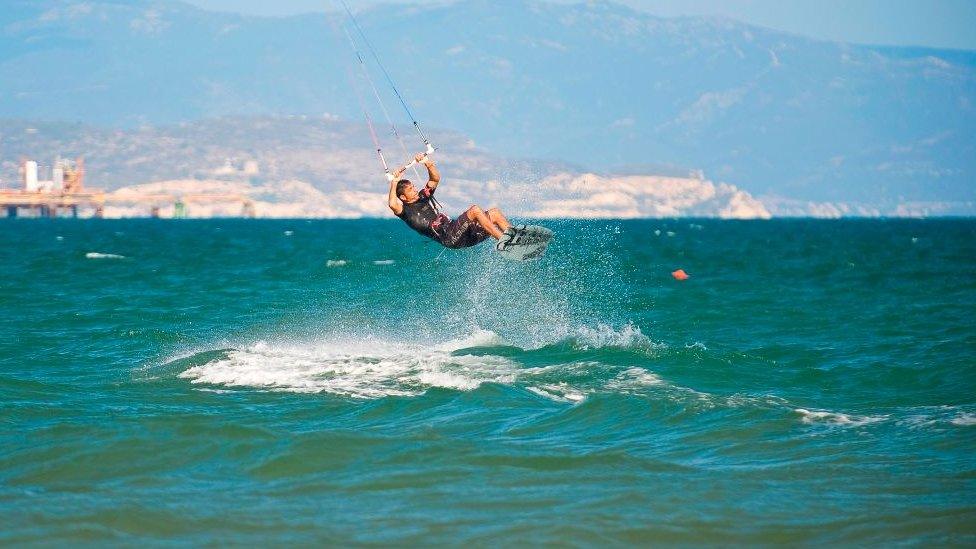 Someone kitesurfing