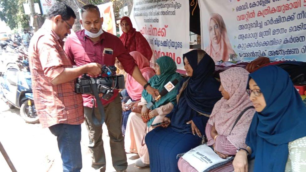 Ms Harshina alongside supporters at the protest